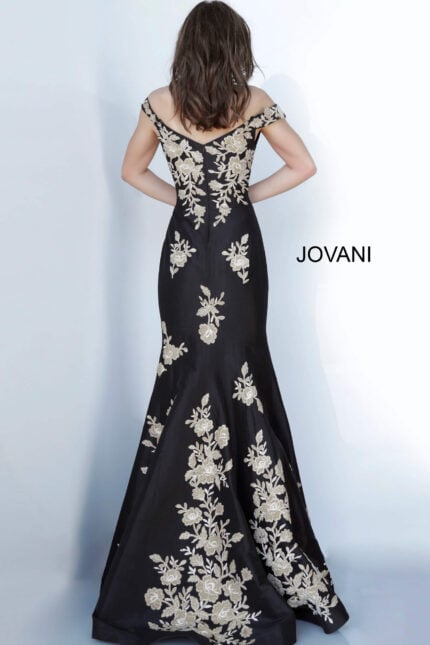 Model wearing Jovani 00635 black gown with gold floral embroidery, back view.