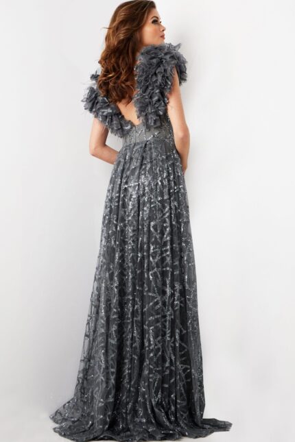 Model in Jovani 37206 gray dress showing back view with ruffled cap sleeves and flowing fabric.