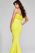 Model wearing Jovani 38922 in yellow, back view, showing the dress's full mermaid silhouette.