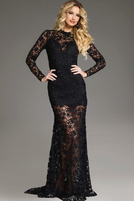 Model wearing Jovani 39034 black gown with floral lace and long sleeves, front view.