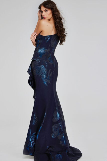 Back view of Jovani 40320 navy dress, highlighting the form-fitting bodice and elegant flare.